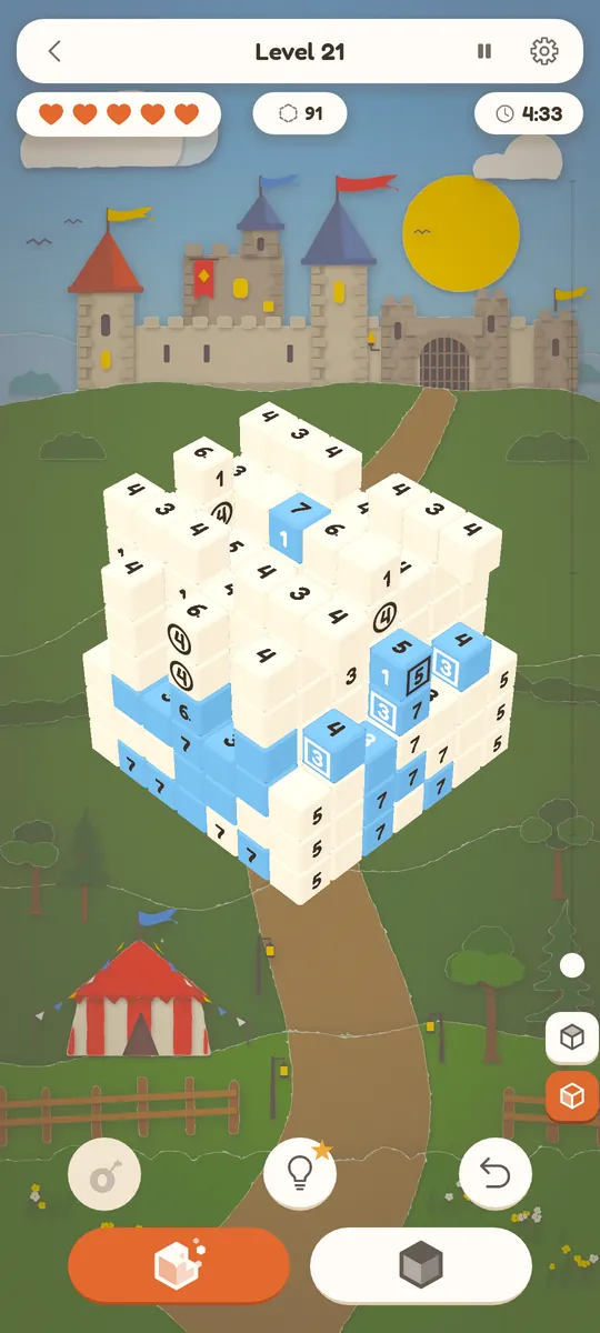 A block mid-solve with circled numbers on some cube faces and blue painted cubes showing where the model is.